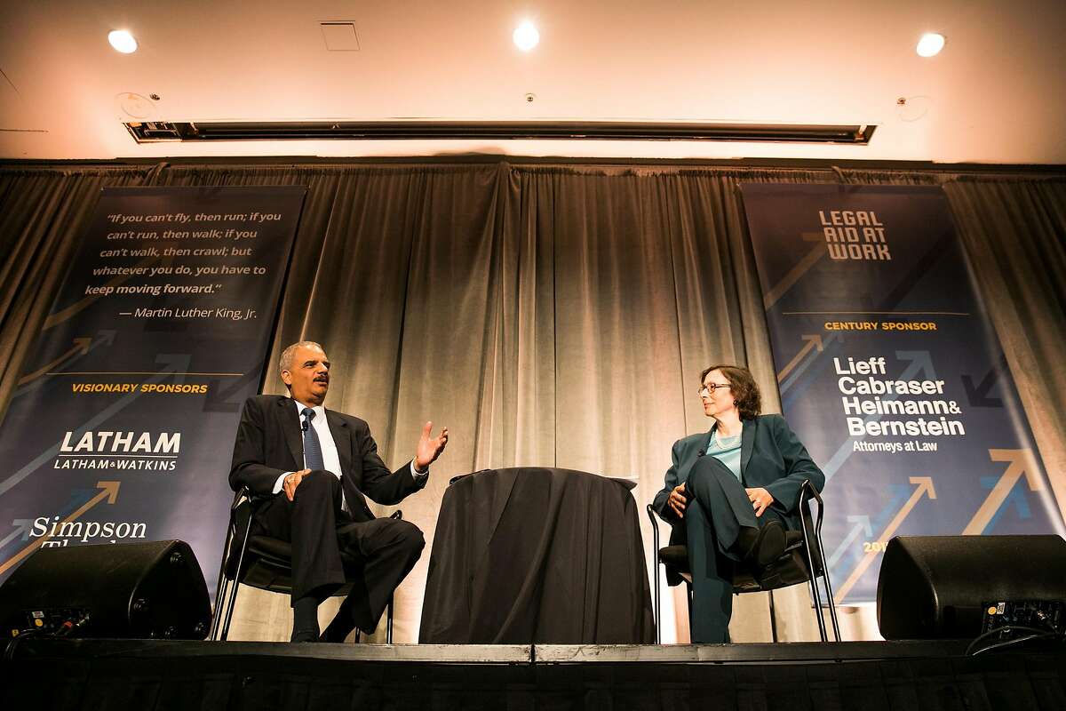 Former U.S. Attorney General Eric Holder talks with Professor of law at Stanford Law School, Pamela S. Karlan, at Legal Aid at Work's 2017 Annual Dinner at the Westin St. Francis in San Francisco, Calif. Wednesday, July 10, 2017.