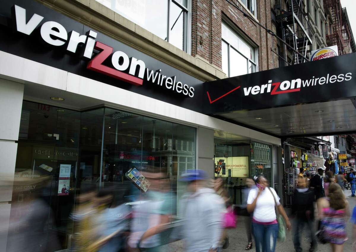 Pedestrians pass a Verizon Wireless store on Canal Street in New York. Verizon confirmed Wednesday that data belonging to 6 million customers was leaked online in June.