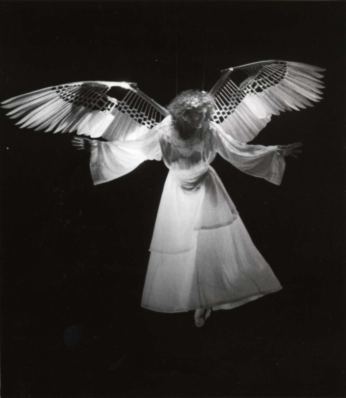 The Angel (Ellen McLaughlin) arrives in the world premiere of "Angels in America," Eureka Theatre Company, San Francisco, 1991. These original wings, designed by Sandra Woodall, will be on display in the exhibition. Credit: Katy Raddatz/Museum of Performance & Design