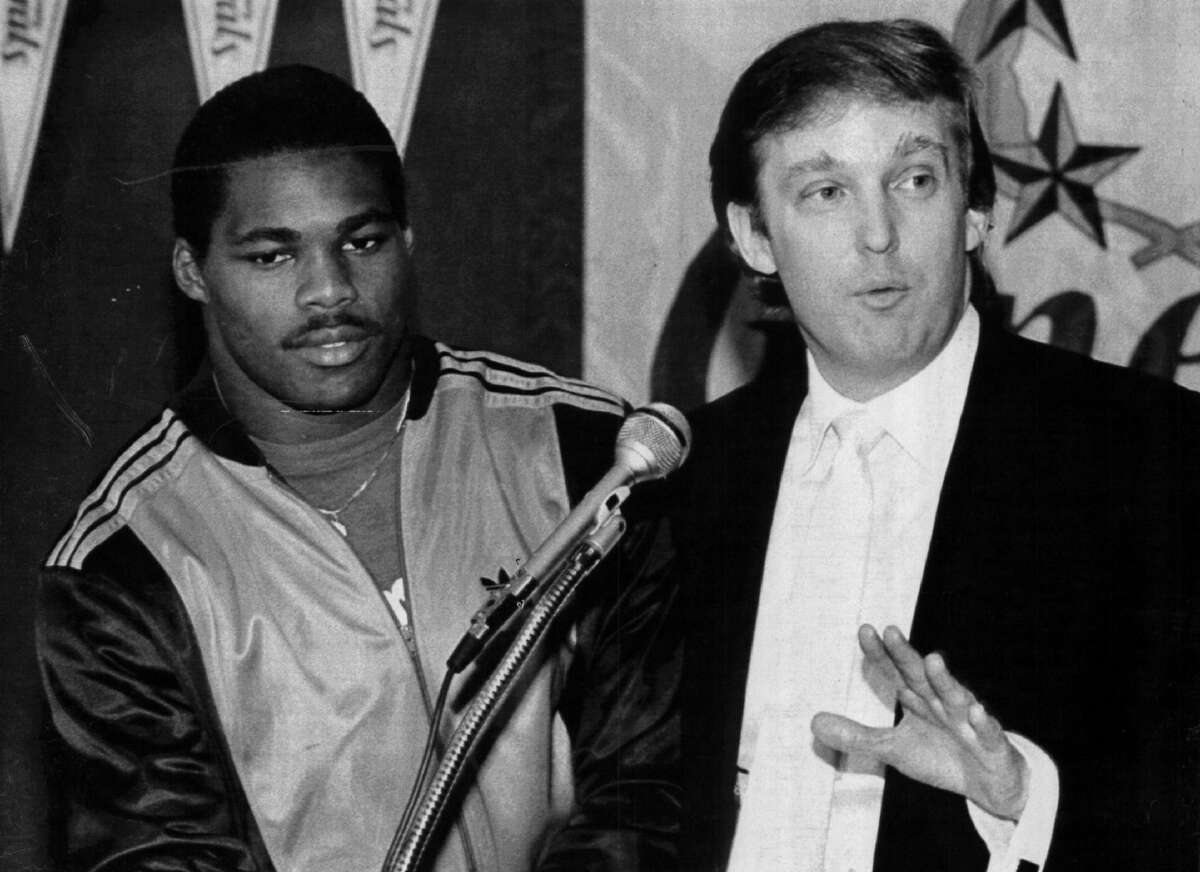 EAST RUTHERFORD, NJ - CIRCA 1983: Team Owner Donald Trump announces he has signed Herschel Walker to play running back for the New Jersey Generals in New Jersey. Walker played for the General form 1983-85. (Photo by Sporting News via Getty Images)