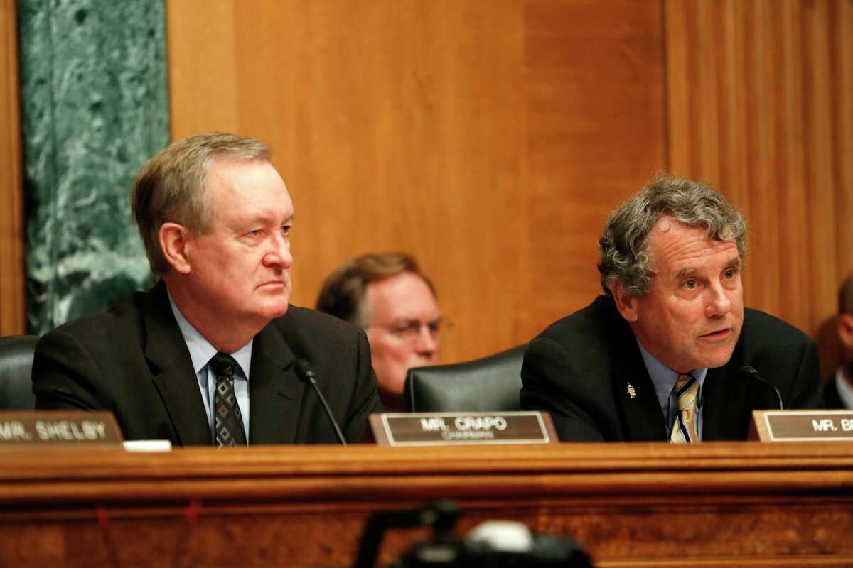 Senate Banking Committee Chairman Sen. Mike Crapo, R-Idaho, left, and the committee's ranking member Sen. Sherrod Brown, D-Ohio, listen on Capitol Hill in Washington, Thursday, July 13, 2017, as Federal Reserve Chair Janet Yellen testified before the committee. (AP Photo/Pablo Martinez Monsivais) ORG XMIT: DCPM206