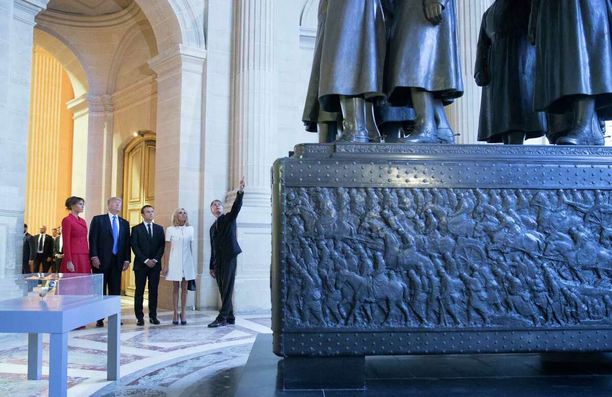 ﻿First lady Melania Trump, President Donald Trump, French President Emmanuel Macron his wife Brigitte Macron, tour Marechal Foch's Tomb ﻿at ﻿the Invalides monument in Paris on Thursday.