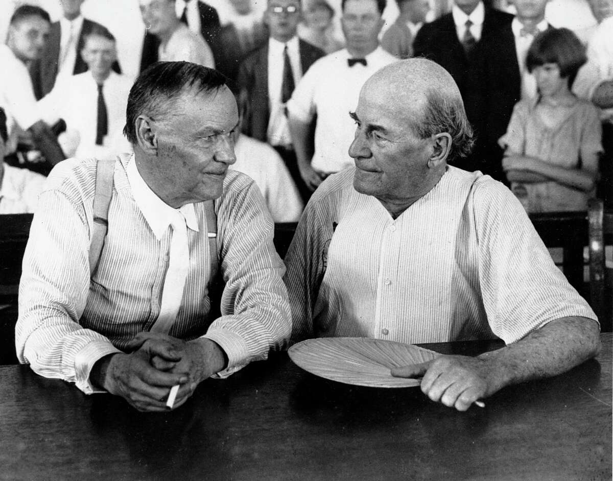 FILE - In this July 1925 file photo, Clarence Darrow, left, and William Jennings Bryan speak with each other during the monkey trial in Dayton, Tenn. On Friday, July 13, 2017, at the Rhea County Courthouse in Dayton, the public will behold a 10-foot statue of the rumpled skeptic Darrow, who argued for evolution in the 1925 trial. It will stand at a respectful distance on the opposite side of the courthouse from an equally huge statue of Bryan, the eloquent Christian defender of the biblical account of creation, which was installed in 2005. (AP Photo, File)