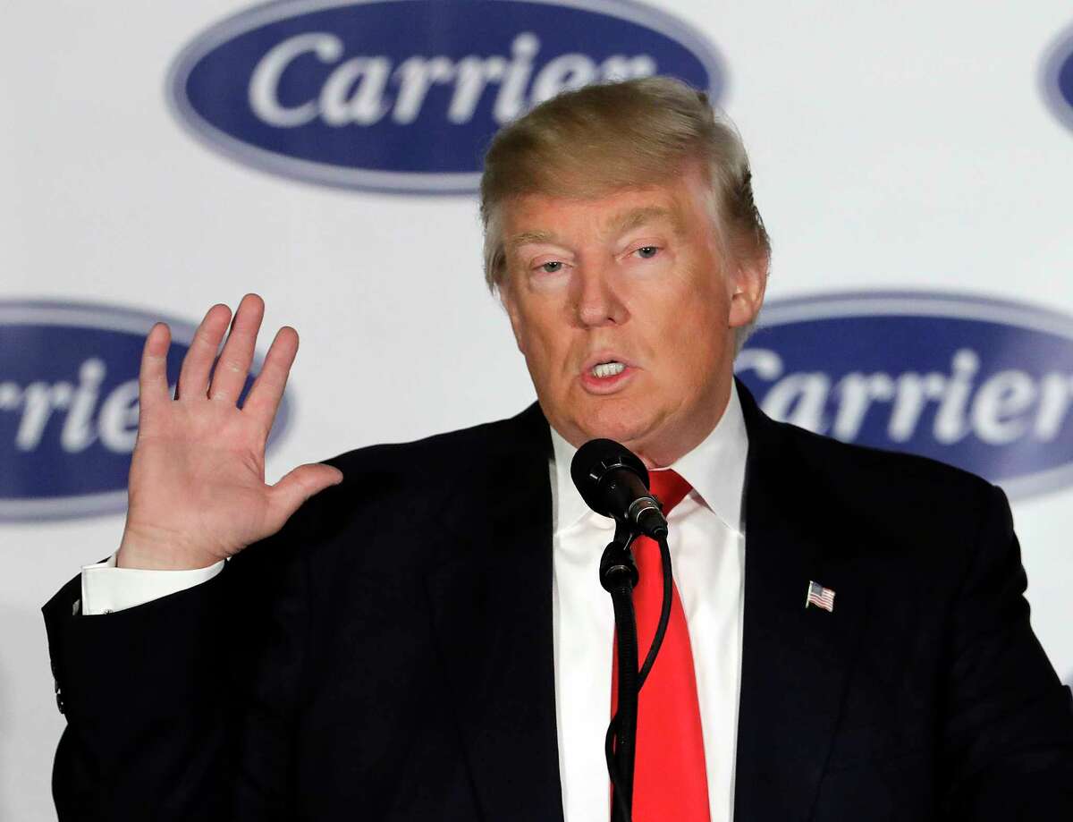 FILE - In this Dec. 1, 2016, file photo, President-elect Donald Trump speaks at the Carrier Corp. factory in Indianapolis where a $7 million deal to save jobs was announced. U.S. Sen. Joe Donnelly, D-Ind., railed against Carrier Corp. for moving manufacturing jobs to Mexico last year, even while he profited from a family business that relies on Mexican labor to produce dye for ink pads, according to records reviewed by The Associated Press. Less than a month after Trump won the election, the company announced an agreement to spare about 800 jobs in Indianapolis. (AP Photo/Darron Cummings, File)