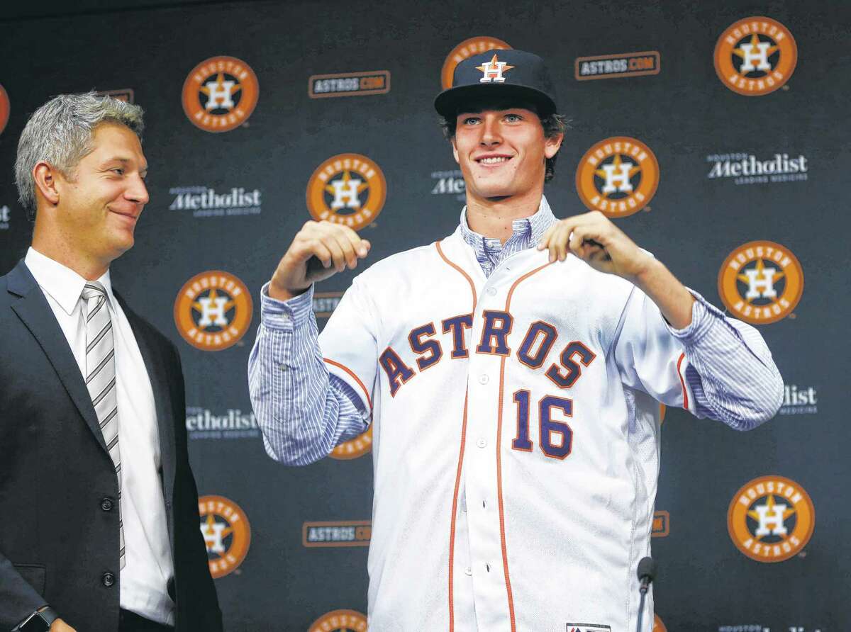 Forrest Whitley, who was selected with the 17th overall pick in the first round of the 2016 MLB First Year Player Draft, was introduced to the media by Astros Director of Amateur Scouting Mike Elias during a press conference after signing with the Astros, before the start of an MLB baseball game at Minute Maid Park, Wednesday, June 22, 2016, in Houston. ( Karen Warren / Houston Chronicle )