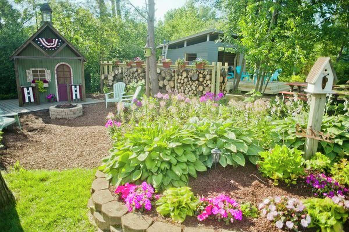 Sam and Kelly PeLong's backyard cottage garden. (Katy Kildee/kkildee@mdn.net)