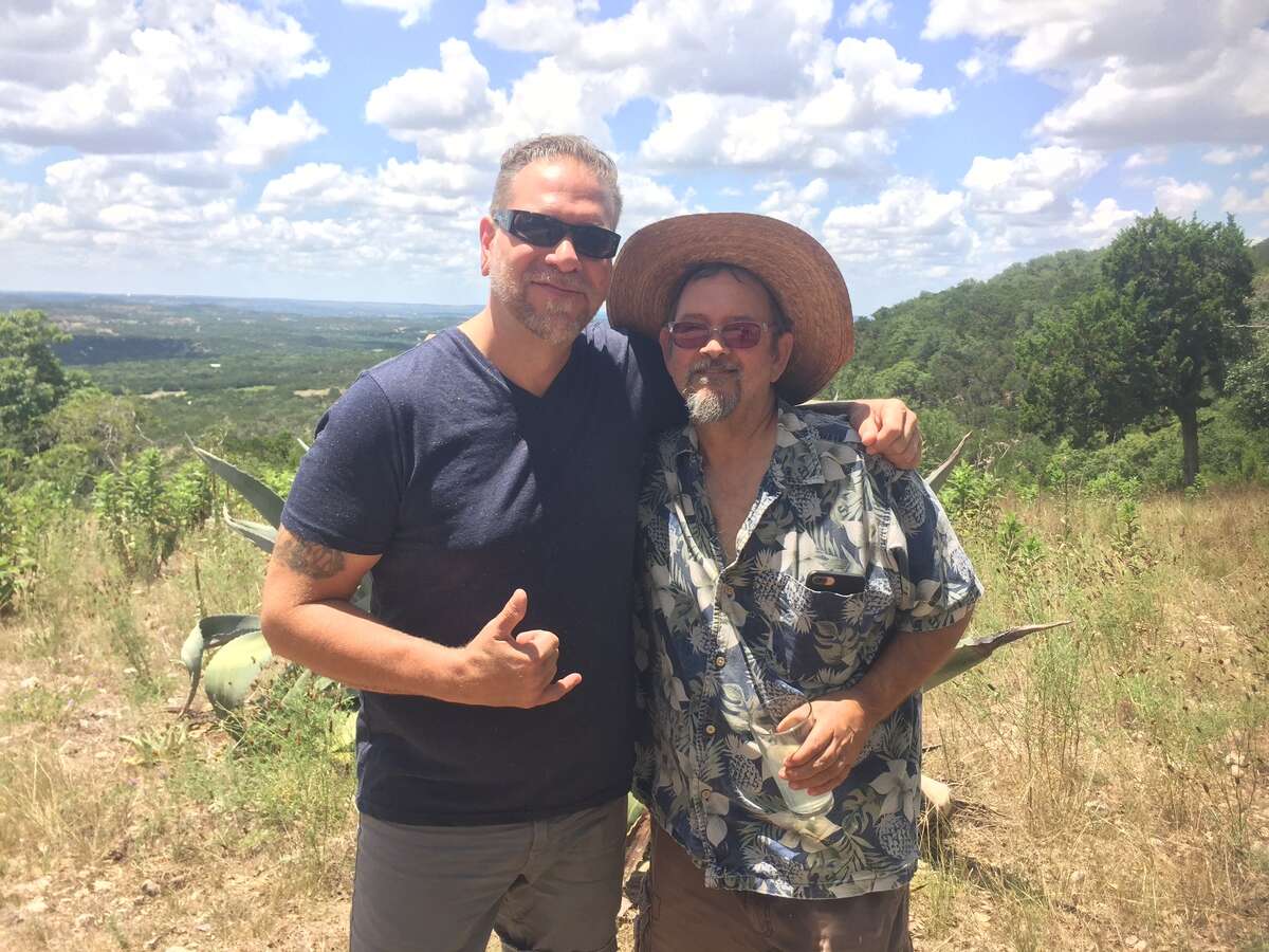 Former "American Chopper" reality star Robb Ortel poses with his subject, dirty car artist Scott Wade, during the Blanco shoot for a new series 'Art Attack.' They plan to shoot Wade's work for the extreme art series today in downtown San Antonio.