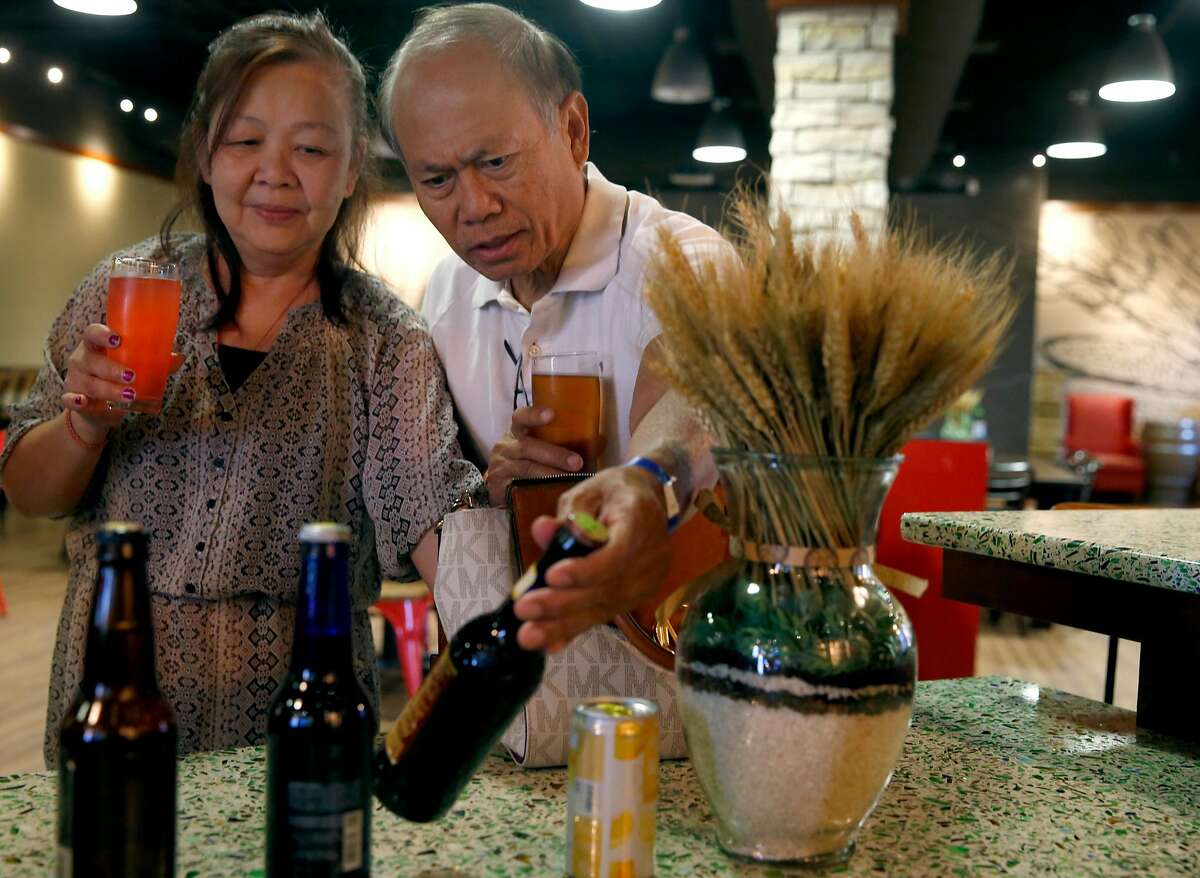 Hongkham Thepkaysone and her husband Bounchanh Thepkaysone sample beers in the Budweiser tasting room after taking a tour of the Anheuser-Busch brewery in Fairfield, Calif. on Friday, June 30, 2017.