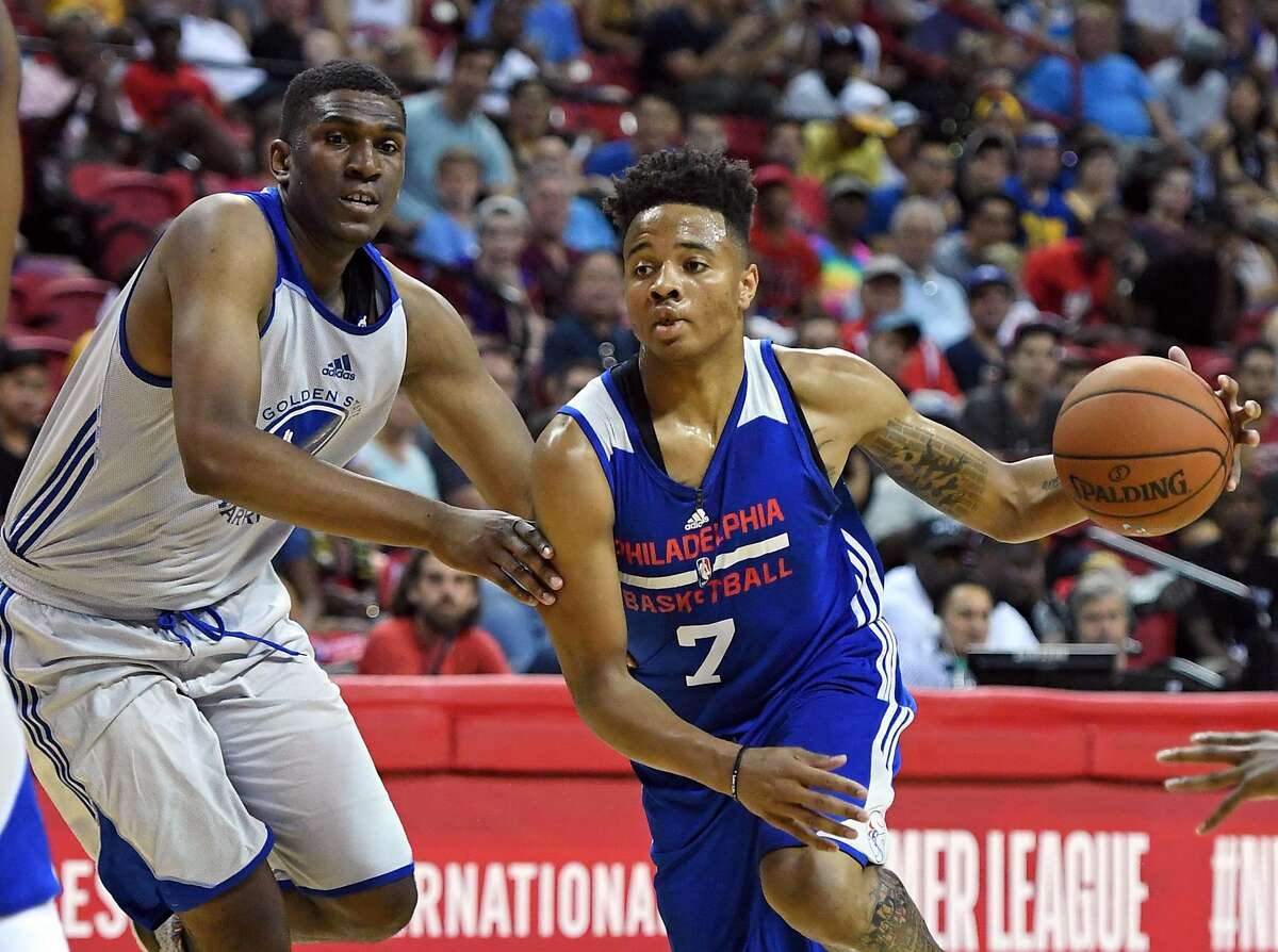 LAS VEGAS, NV - JULY 08: Markelle Fultz #7 of the Philadelphia 76ers drives against Kevon Looney #5 of the Golden State Warriors during the 2017 Summer League at the Thomas & Mack Center on July 8, 2017 in Las Vegas, Nevada. NOTE TO USER: User expressly acknowledges and agrees that, by downloading and or using this photograph, User is consenting to the terms and conditions of the Getty Images License Agreement. (Photo by Ethan Miller/Getty Images)