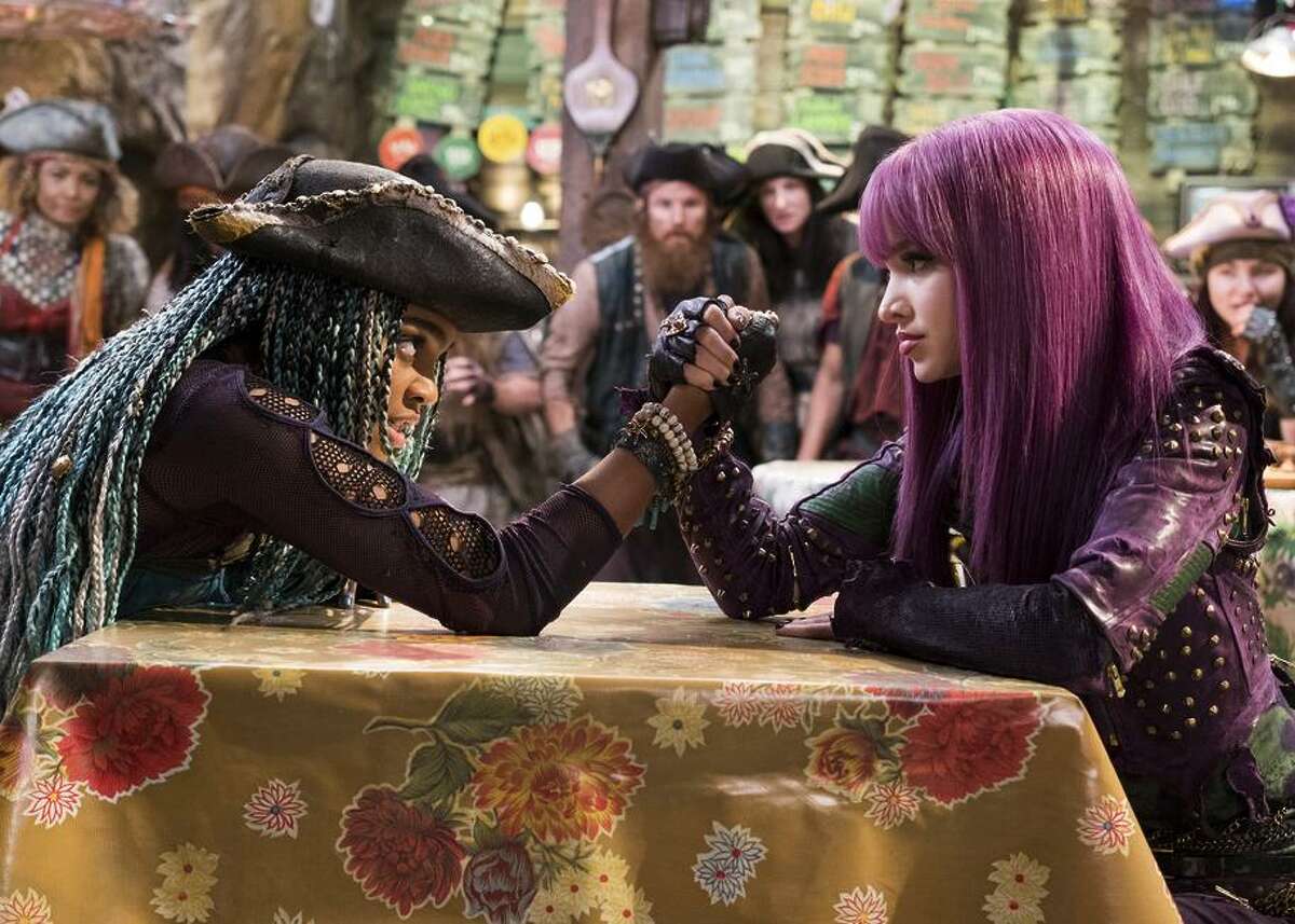 China Anne McClain as Freddie (left) takes on Dove Cameron’s Mal, who isn’t adjusting to life as queen in “Descendants 2.”