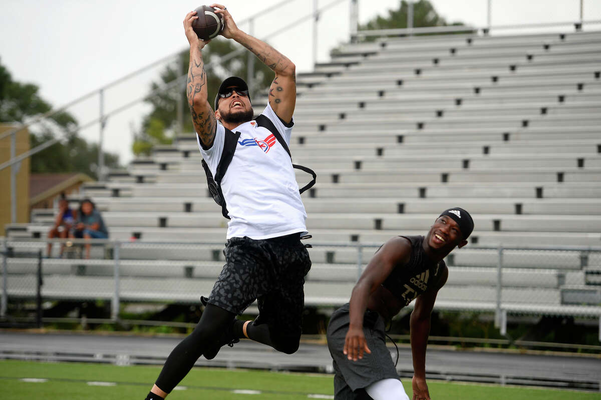 Tampa Bay Buccaneers wide receiver Mike Evans catches a pass while running routes during New England Patriots linebacker Elandon Roberts' charity 5K and 7-on-7 football tournament in Port Arthur on Saturday. Roberts, who went to Memorial High School, held the event to raise awareness of heart disease. Photo taken Saturday 7/15/17 Ryan Pelham/The Enterprise