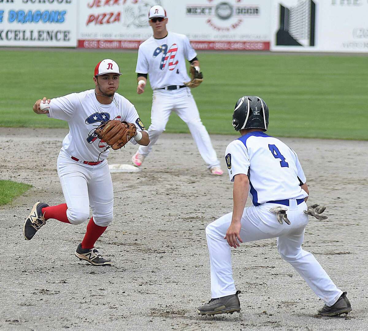 Norwalk’s Mo Ortiz-Echeverria, left, catches Middletown’s Tim Dickson off first base for a run-down out during Saturday’s American Legion baseball state tournament opening-round game at Palmer Field in Middletown. Host Middletown won 5-0.