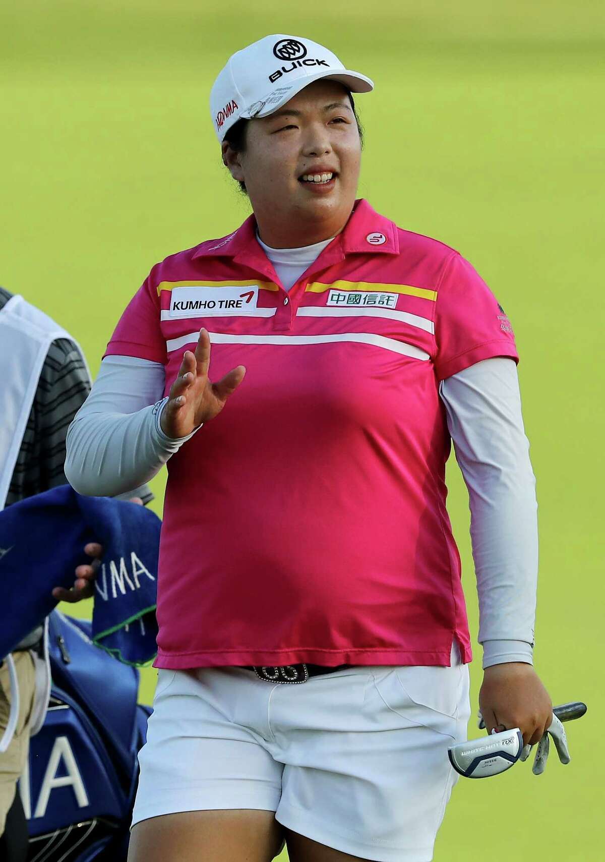 BEDMINSTER, NJ - JULY 15: Shanshan Feng of China greets the fans as she approaches the 18th green during the U.S. Women's Open round three on July 15, 2017 at Trump National Golf Club in Bedminster, New Jersey. (Photo by Elsa/Getty Images)