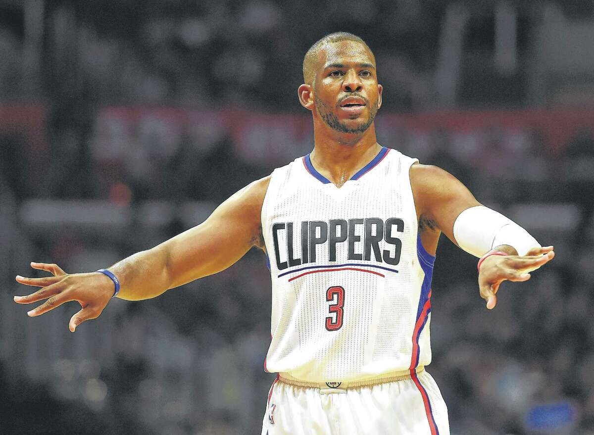 FILE - JUNE 28, 2017: It is being reported that the Los Angeles Clippers have traded Chris Paul to the Houston Rockets for Sam Dekker, Patrick Beverley, Lou Williams and a 2018 first-round draft pick. LOS ANGELES, CA - NOVEMBER 09: Chris Paul #3 of the Los Angeles Clippers motions to his teammates during a 111-80 win over the Portland Trail Blazers at Staples Center on November 9, 2016 in Los Angeles, California. NOTE TO USER: User expressly acknowledges and agrees that, by downloading and or using this photograph, User is consenting to the terms and conditions of the Getty Images License Agreement. (Photo by Harry How/Getty Images)