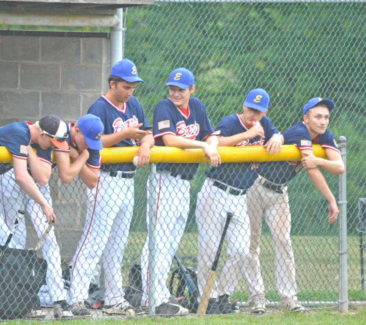 Edwardsville Bears players watch from the dugout during Thursday’s District 22 tournament game against Highland at Hoppe Park.