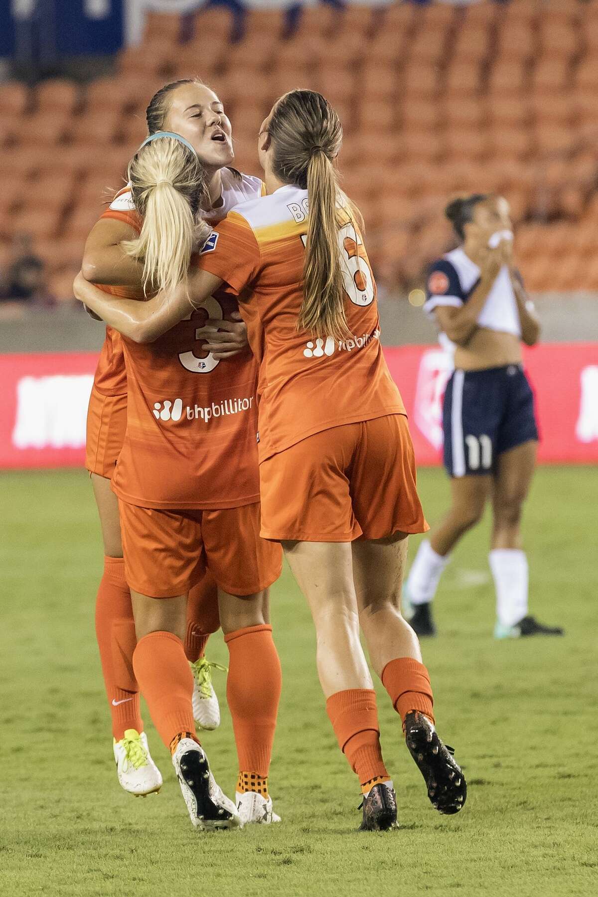 Houston Dash forward Janine Beckie (16) and forward Rachel Daly (3) celebrate with midfielder Andressa Cavalari Machry (17) after a goal in the second half during the NWSL game between the Washington Spirit and Houston Dash on Saturday July 15, 2017. The Dash defeated the Spirit 2-1.