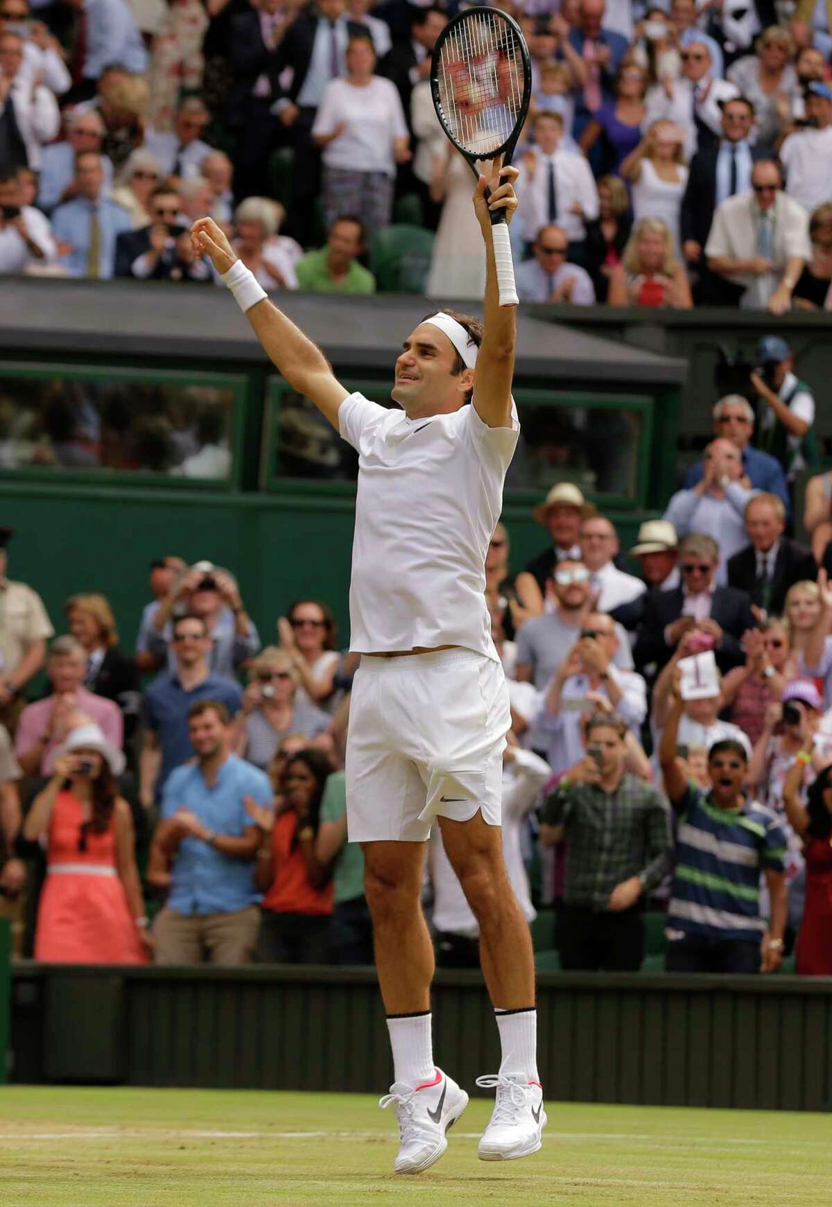 Switzerland's Roger Federer celebrates after defeating Croatia's Marin Cilic to win the Men's Singles final match on day thirteen at the Wimbledon Tennis Championships in London Sunday, July 16, 2017. (AP Photo/Alastair Grant)