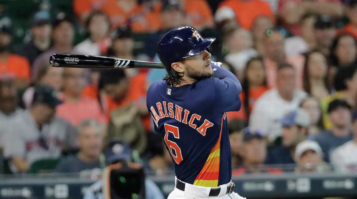 Houston Astros' Jake Marisnick hits an RBI-single to score Alex Bregman during the second inning of a baseball game against the Minnesota Twins, Sunday in Houston.