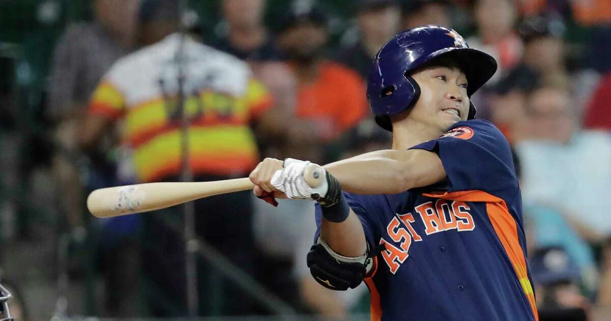 Houston Astros' Norichika Aoki hits a single against the Minnesota Twins during the second inning of a baseball game Sunday in Houston.