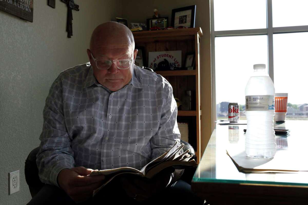 Rev. Richard Koons looks through his Bible before a giving a sermon at SouthPointe Baptist Church in Arlington, Texas on June 9, 2017. Thirty years ago a flash flood claimed the lives of ten teens from the Dallas area on their way home from church camp on July 17, 1987 in Comfort, Texas. Rev. Richard Koons was the driver of the bus that swept away and his wife, Lavonda, was swept a mile downstream. (photo Â Lara Solt)