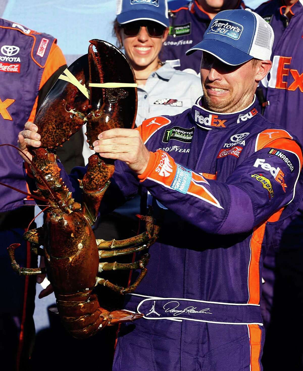 It was Denny Hamlin's turn at a much-celebrated New Hampshire Motor Speedway tradition - posing and grimacing with a giant lobster - after winning the Monster Energy Cup race Sunday.