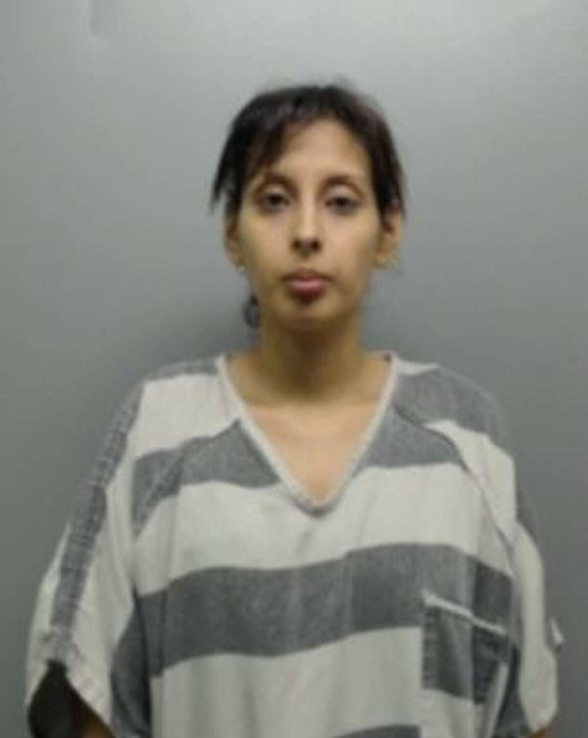 Vanessa Garza, 34, was served with warrants that charged her with 35 counts of credit or debit card abuse and felony theft.
