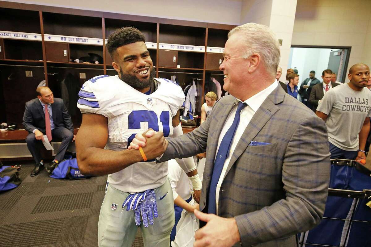 Stephen Jones congratulates running back Ezekiel Elliott on Nov. 20, 2016 after the Dallas Cowboys defeated Baltimore 27-17 at AT&T Stadium.