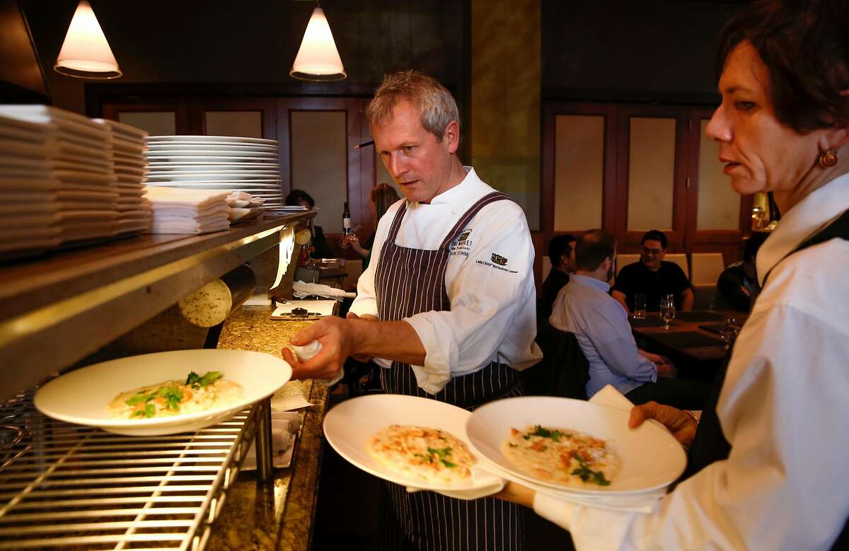 Chef Mark Dommen keeps the plates moving out of the kitchen for the lunch crowd at One Market restaurant which is inside Super Bowl City at the foot of market street as seen on Thurs. January 28, 2016, in San Francisco, Calif.