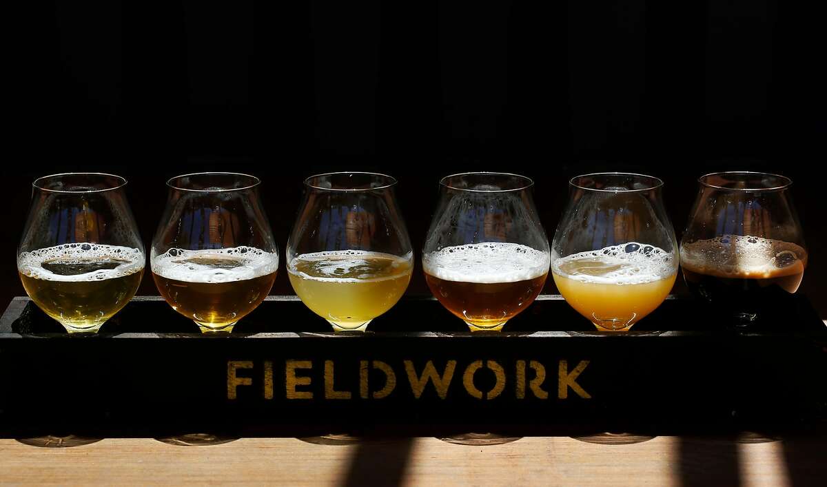 A flight of beer, from left, Old Love, Rancher, Gosaic, Treasure Hands, Overripe!, and Salted Coconut pictured at Fieldwork Brewing Company July 14, 2017 in San Mateo, Calif.