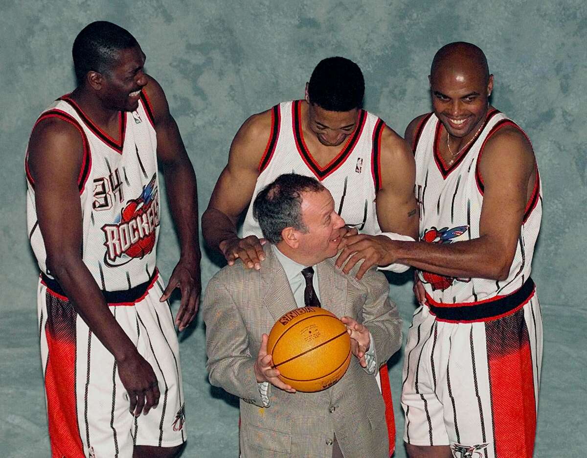 Houston Rockets', from left to right, Hakeem Olajuwon, Scottie Pippen and Charles Barkley joke with team owner Leslie Alexander, front, as they pose for a photograph during media day Tuesday, Jan. 26, 1999 in Houston. The Rockets will play an exhibition game with the San Antonio Spurs Tuesday night. (AP Photo/David J. Phillip)