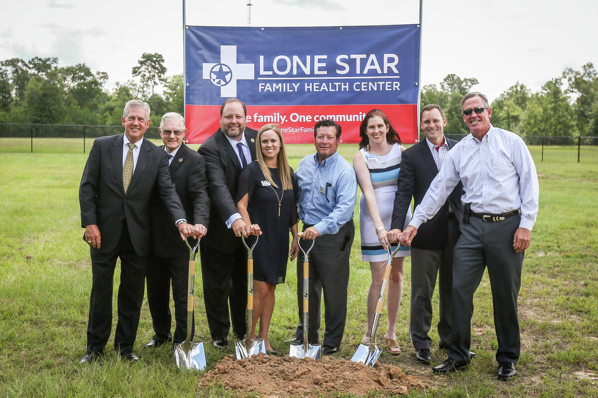 Local elected officials and leadership from Conroe ISD and Lone Star Family Health Center pose for a photo during the groundbreaking for a Lone Star Family Health Center clinic on Monday, July 17, 2017, on the campus of Ben Milam Elementary School in Grangerland.