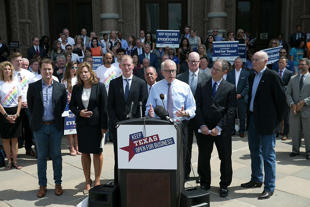Jeff Moseley, with Texas Association of Business, joins other Texas business and tourism representatives who gathered on the south steps of the state capitol on Monday July 17, 2017 to urge lawmakers not to approve bills to regulate transgender bathroom access. They contend such laws would be discriminatory and have a negative impact on the state's economy. (Ralph Barrera/Austin American-Statesman via AP)