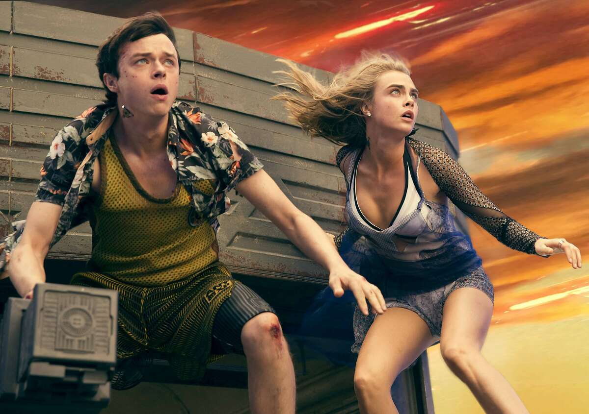 This image released by STX Entertainment shows Dane DeHaan, left, and Cara Delevingne in a scene from "Valerian and the City of a Thousand Planets." (Vikram Gounassegarin/STX Entertainment via AP)