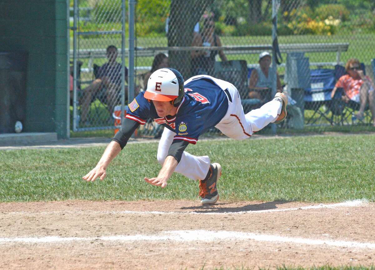 The Bears’ Will Messer dives into home plate to score a run during the sixth inning.