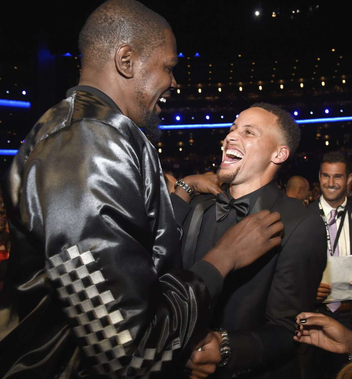Warriors Kevin Durant (left) and Stephen Curry enjoy themselves at last week’s ESPYs. The Warriors were honored as best team, and Durant won for best championship performance.