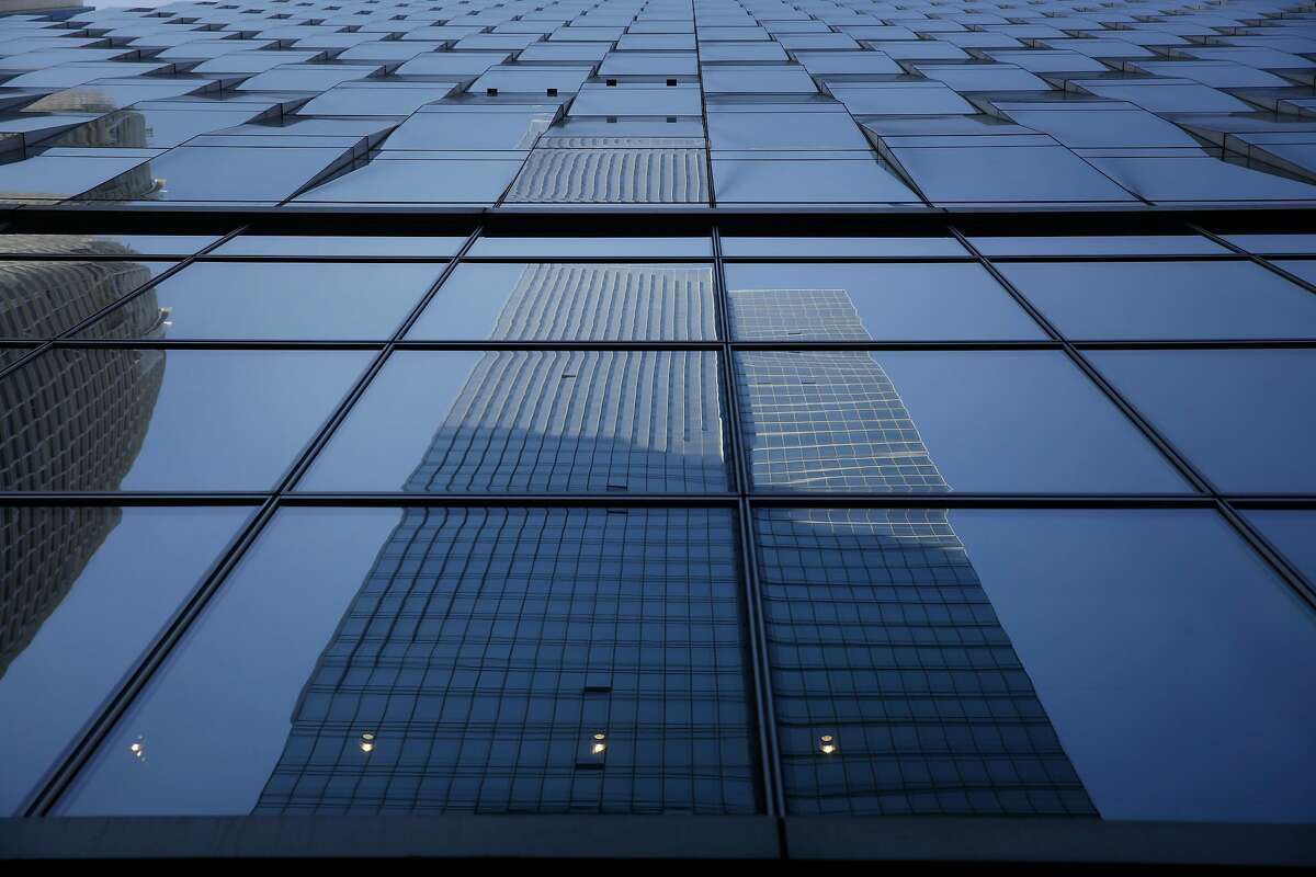 Millenium Tower is seen reflected in Salesforce East at 350 Mission Street on Tuesday, July 18, 2017 in San Francisco, Calif.