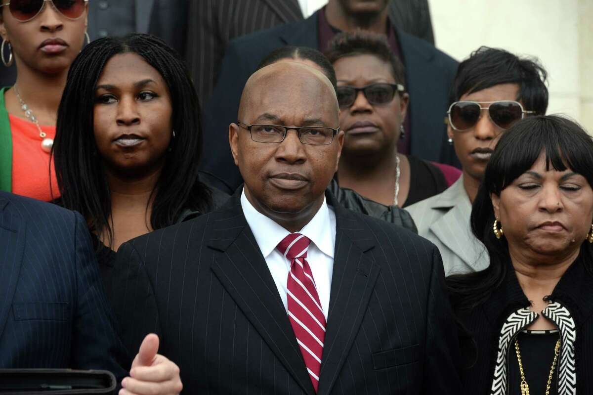 Walter Diggles, center, the Executive Director of the Deep East Texas Council of Governments, his wife Rosie Diggles, right and daughter Anita Diggles, left, are named in a federal indictment stemming from the FBI's 2014 raid of the DETCOG offices. Photo taken during a press conference at the Federal Courthouse on Monday. Photo taken Monday, December 21, 2015 Guiseppe Barranco/The Enterprise