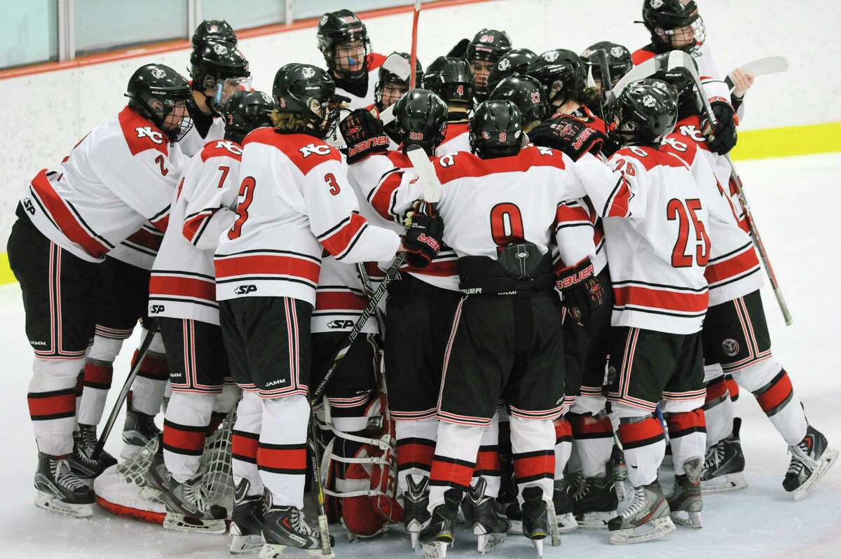 The New Canaan High School boys hockey team during the FCIAC boys ice hockey semifinal game between Greenwich High School and New Canaan High School at Terry Conners Rink in Stamford March 1.