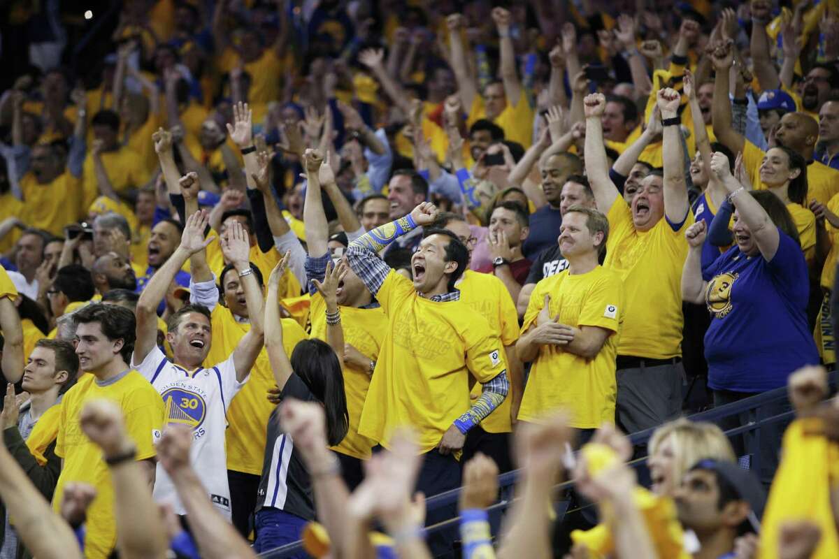 Fans react in the final minutes of Game 5 of the NBA Finals between the Golden State Warriors and the Cleveland Cavaliers on Monday, June 12, 2017, at Oracle Arena in Oakland, Calif.