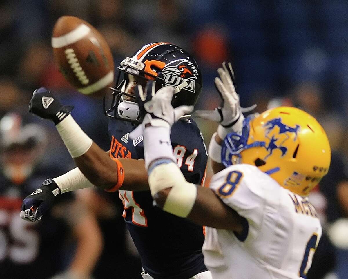 UTSA receiver Brandon Freeman (84) and McNeese defender Seth Thomas (8) fight for a passed ball during college football action in the Alamodome on Saturday, Nov. 10, 2012.