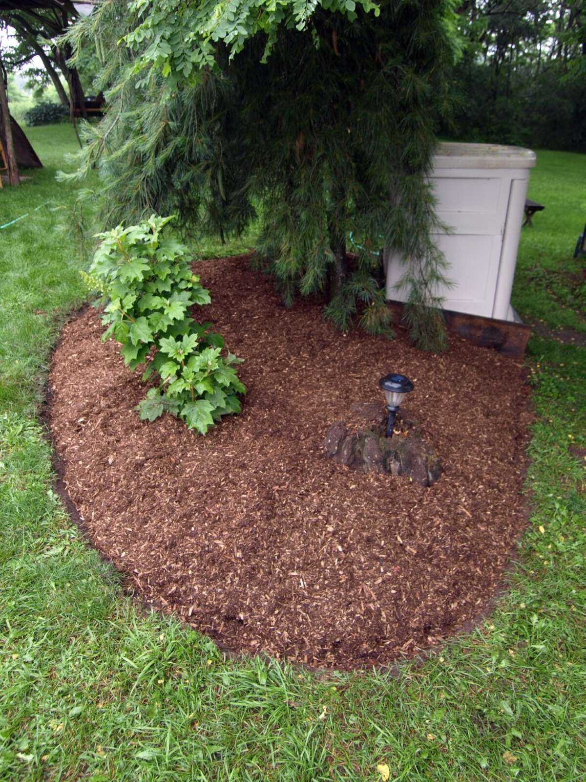 Gardening Mulched beds make mowing easier