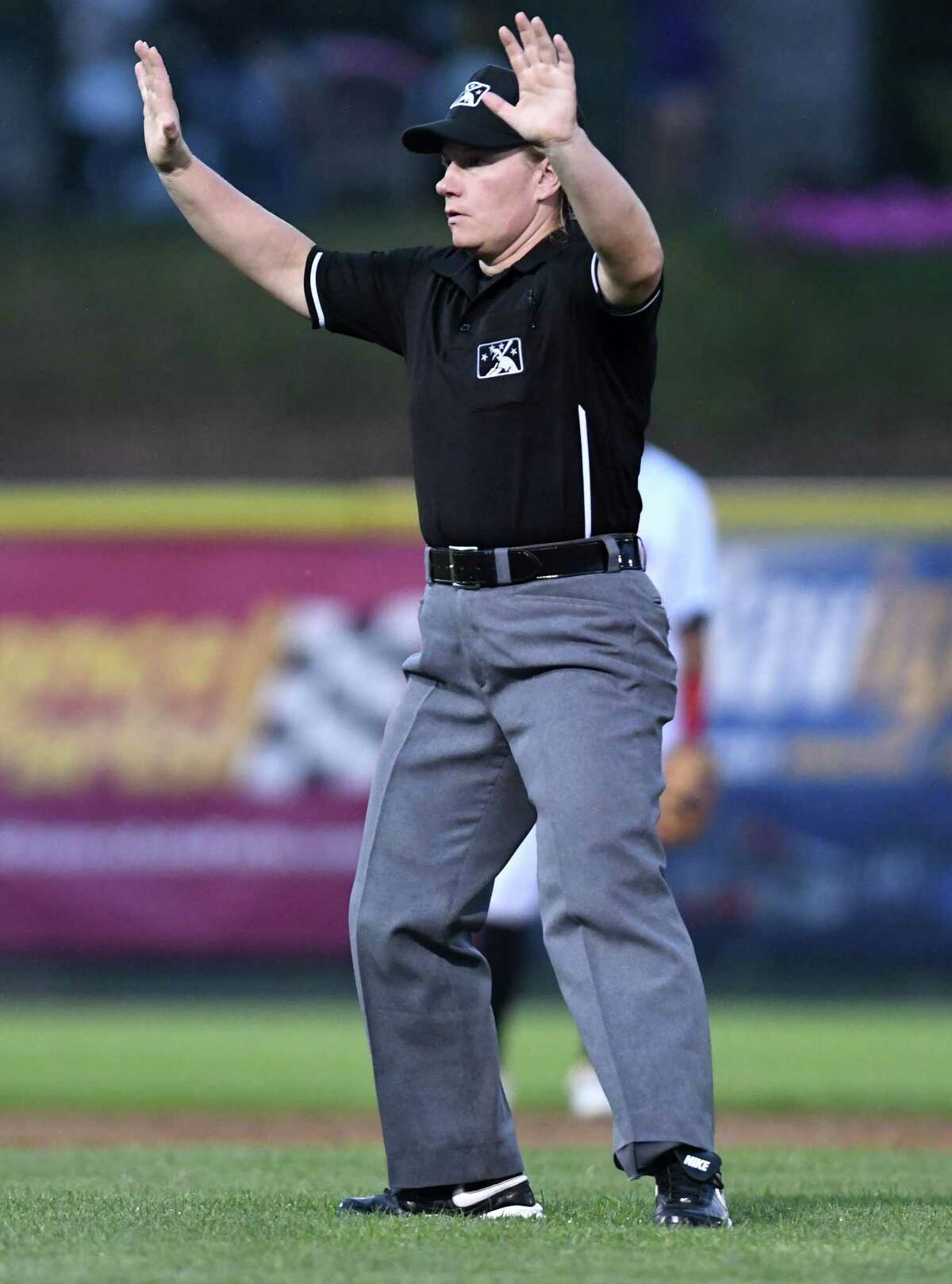 For female umpire, one pitch at a time up pro baseball ladder photo