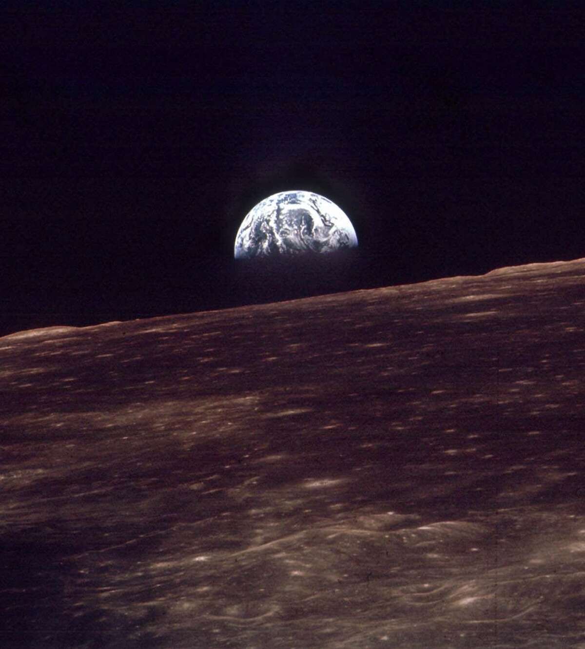 The earth rises over the horizon of the moon in this Dec. 24, 1968 file photo made by the astronauts on Apollo 8. (AP Photo/NASA)