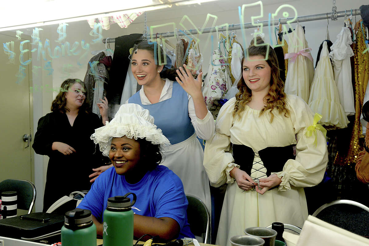 Essence Fontenot, 18, (seated) and Emily Evans, 16, (right) react as lead character Mady Rogers, 18, jokes with them in the dressing room as cast members with the Beaumont Community Players' KIDmunity TROUPE prepare for the full dress rehearsal for their upcoming production of "Beauty and the Beast" at the Betty Greenberg Center for Performing Arts Wednesday. Directed by DeeDee Howell, the popular Disney tale will run Thursday through Saturday at 7 p.m., and include a 2 p.m. matinee performance Saturday. Photo taken Wednesday, July 19, 2017 Kim Brent/The Enterprise