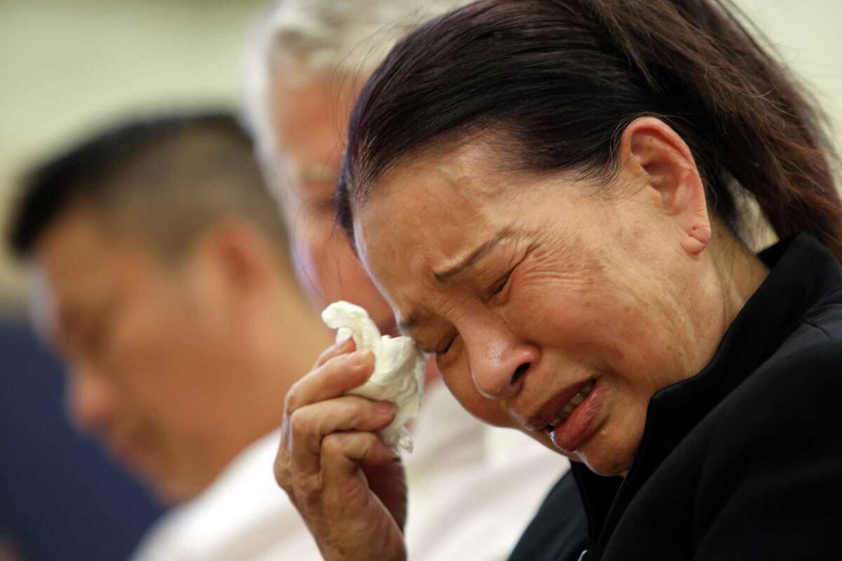 Kim Le, grandmother of Tommy Le, cries during a public forum held by the family of Le, a 20-year-old high school student who was shot and killed by King County Sheriff's deputies in June, Wednesday, July 19, 2017 at the Asian Counseling and Referral Service. Family members say Tommy lived with his grandmother for several years.