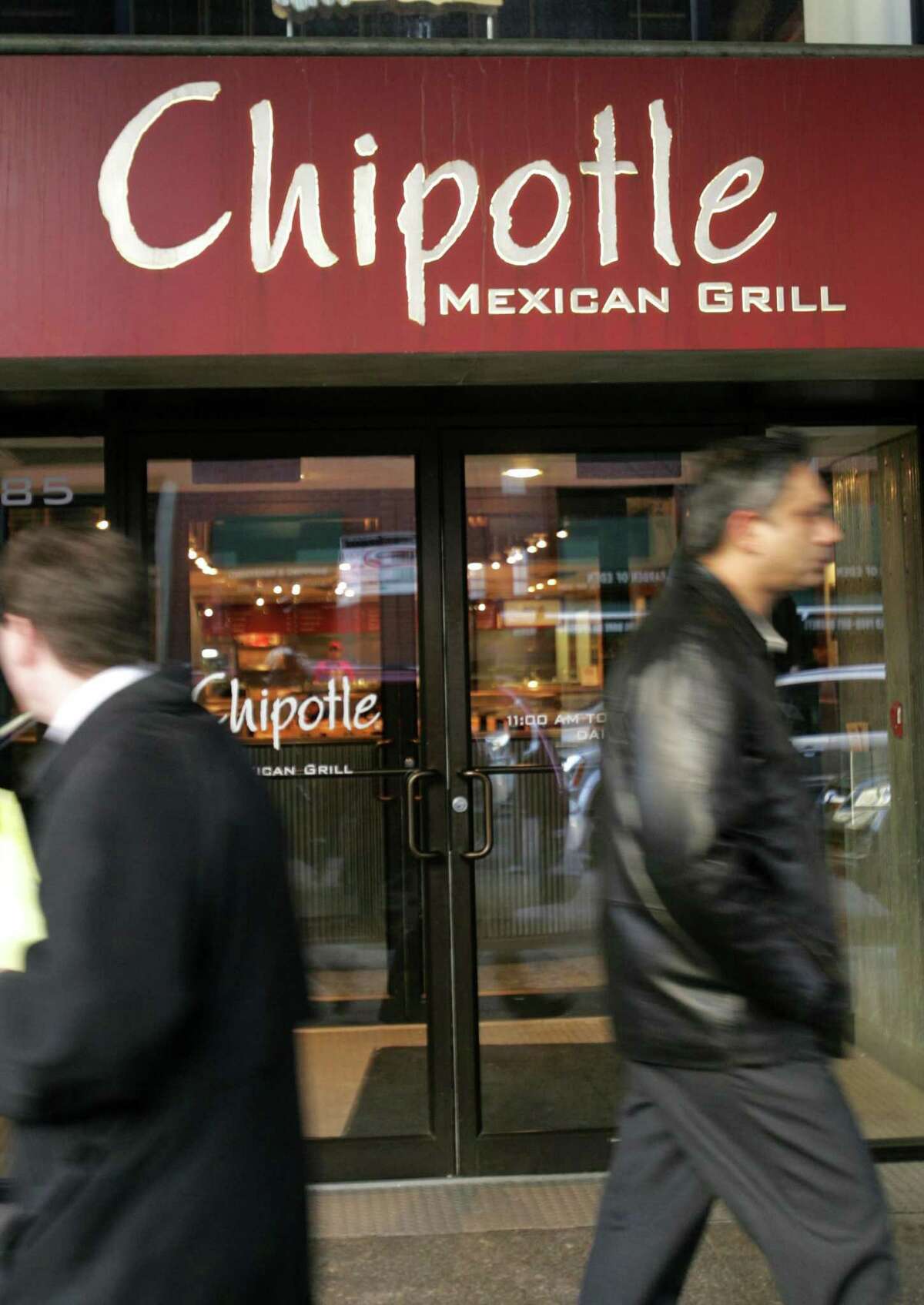 File photo of a Chipotle Mexican Grill in the Brooklyn borough of New York. A Facebook video showed one rodent scurrying across the ground at a Chipotle in Dallas, another climbing the wall and a third limp on the ground.
