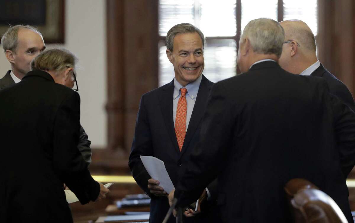 Texas Speaker of the House Joe Straus, R-San Antonio, center, visits with fellow lawmakers on the House floor in Austin, Texas, Tuesday, July 18, 2017. State lawmakers begin a special legislative session Republican Gov. Greg Abbott felt compelled to call in order to tackle conservative priorities that stalled previously, chief among them a "bathroom bill" targeting transgender people. (AP Photo/Eric Gay)
