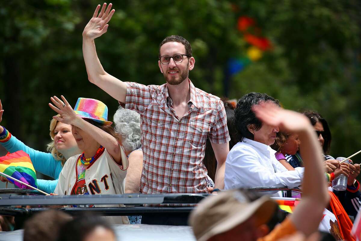 State Sen. Scott Wiener, who sponsored a bill restricting communities� ability to quash housing projects, rides along in the San Francisco Gay Pride Parade, June 25, 2017. A full-fledged housing crisis has gripped California, where the lack of affordable homes and apartments for middle-class families is severe. The median cost of a home here is now a staggering $500,000, twice the national cost. Homelessness is surging across the state. �We�re at a breaking point in California,� Wiener said. (Jim Wilson/The New York Times)