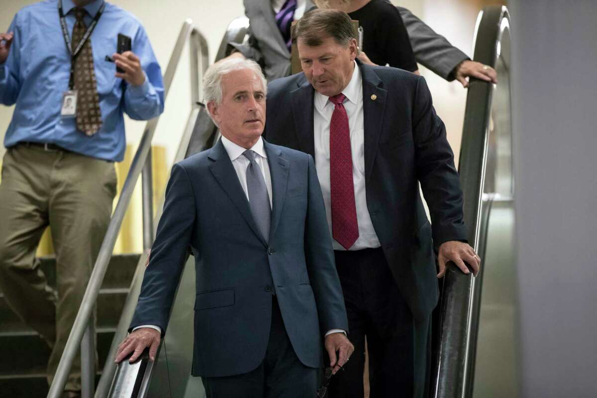 Sen. Bob Corker, R-Tenn., chairman of the Senate Foreign Relations Committee, and Sen. Mike Rounds, R-S.D., rear, leave the Senate after final votes of the week, on Capitol Hill in Washington, Thursday, July 20, 2017. Senate Majority Leader Mitch McConnell, R-Ky., is spurring Republican senators to resolve internal disputes that have pushed their marquee health care bill to the brink of oblivion, a situation made more difficult for the GOP because of Sen. John McCain's jarring diagnosis of brain cancer. (AP Photo/J. Scott Applewhite)