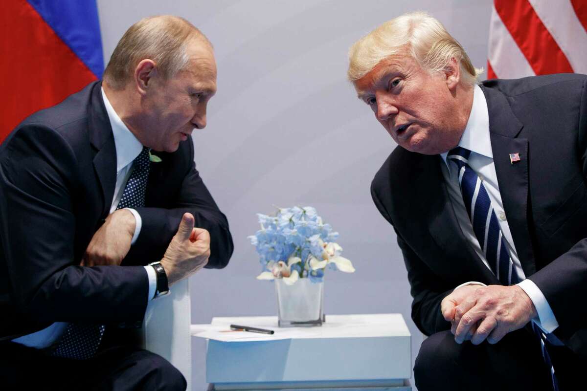 FILE - In this July 7, 2017, file photo, President Donald Trump meets with Russian President Vladimir Putin at the G20 Summit in Hamburg, Germany. Trump had a second, previously undisclosed conversation with Putin at the summit it Germany. White House spokesman Sean Spicer says that Trump and Putin spoke during a world leadersÂ?’ dinner at the Group of 20 summit in Hamburg earlier this month.(AP Photo/Evan Vucci)